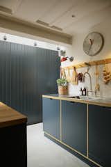 Kitchen, Recessed, Concrete, Wall, Wood, Metal, Wood, Drop In, and Ceramic Tile The kitchen joinery is by Barnaby Reynolds.

  Kitchen Recessed Wall Wood Photos from Before & After: A London Home Doubles as a Cheery Work Space