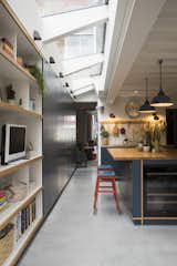 Kitchen, Concrete, Wine Cooler, Wood, Wall, Wood, Ceramic Tile, Drop In, and Pendant The expansive skylights are by Rooflight Architectural.

  Kitchen Ceramic Tile Wood Drop In Pendant Photos from Before & After: A London Home Doubles as a Cheery Work Space