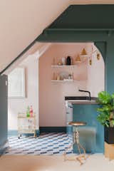 A small kitchen is located in the attic, and has been largely decorated with IKEA furnishings.
