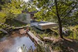 Outdoor, Trees, Large Patio, Porch, Deck, Large Pools, Tubs, Shower, Front Yard, and Grass  Photo 1 of 15 in Two Ponds Bookend This Concrete-and-Wood Residence in Portugal