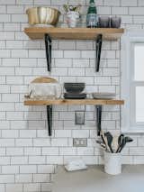 Kitchen, Subway Tile Backsplashe, and Engineered Quartz Counter Subway tiles from Home Depot.  Photos from Budget Breakdown: A Denver Kitchen Gets a Beautiful IKEA Makeover For Just $7.8K