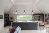 A streamlined, modern kitchen with shiplap joinery.