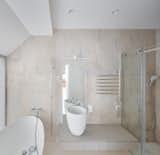 A bathroom is the only enclosed space on the upper level.