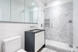 Bath Room, Two Piece Toilet, Enclosed Shower, Marble Counter, Ceiling Lighting, Recessed Lighting, Marble Floor, and Undermount Sink The bathroom on the second level.

  Photo 13 of 14 in An Updated 1845 Brooklyn Home Hits the Market at $2.95M