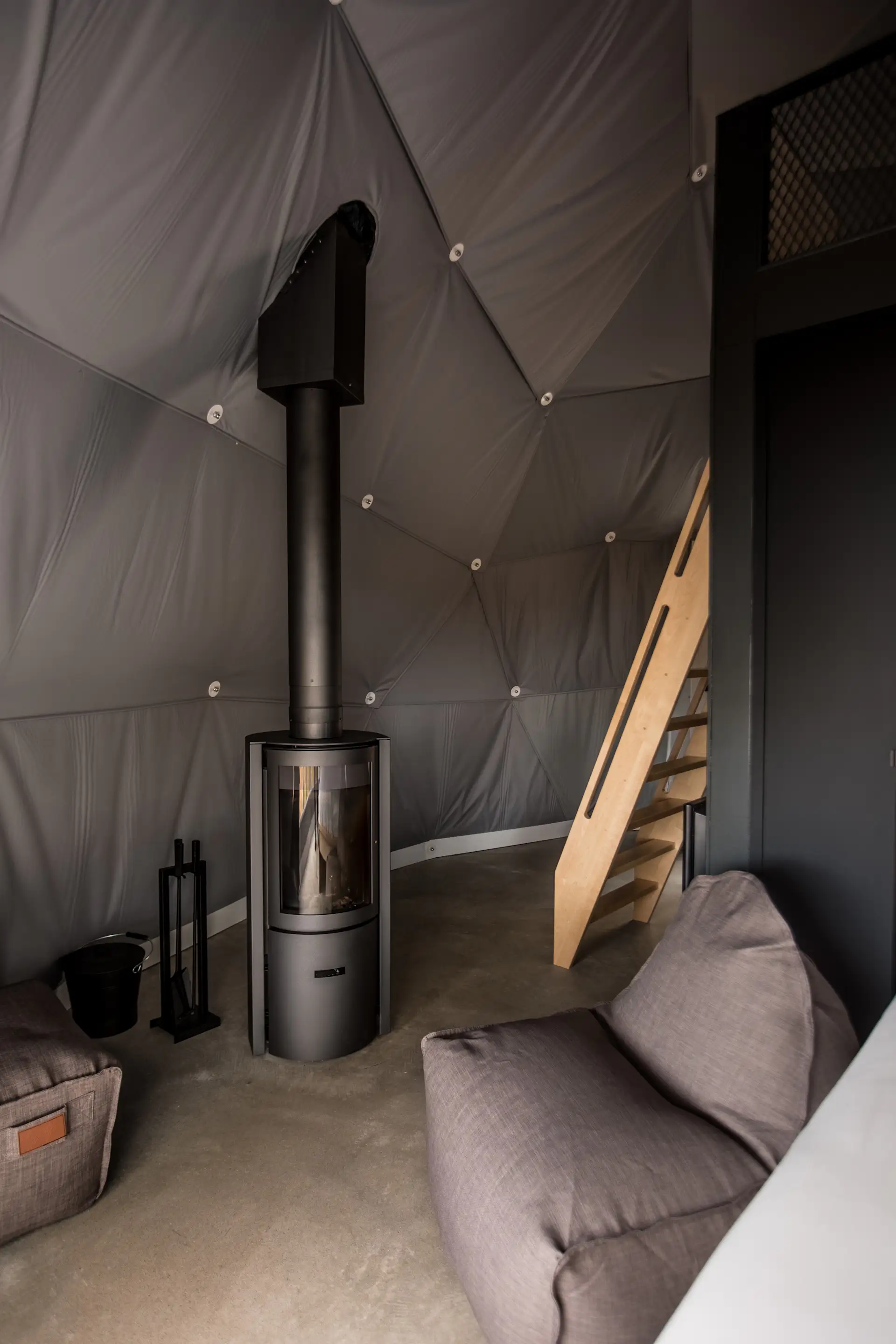 Woog by Mobilia bean bag seats and a STUV 30-compact fireplace create a cozy interior.