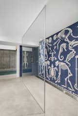 The pool is accessed by crossing the Paleolithic mosaic that adorns the walls of the shower.