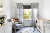Keep the nursery calm and serene for both mom and babe with cozy grays and earthy neutrals.