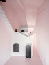 Dream is painted a soft pink. All the "mundane" components of daily life, such as lighting fixtures and electronic appliances, have been concealed behind a series of black doors.&nbsp;