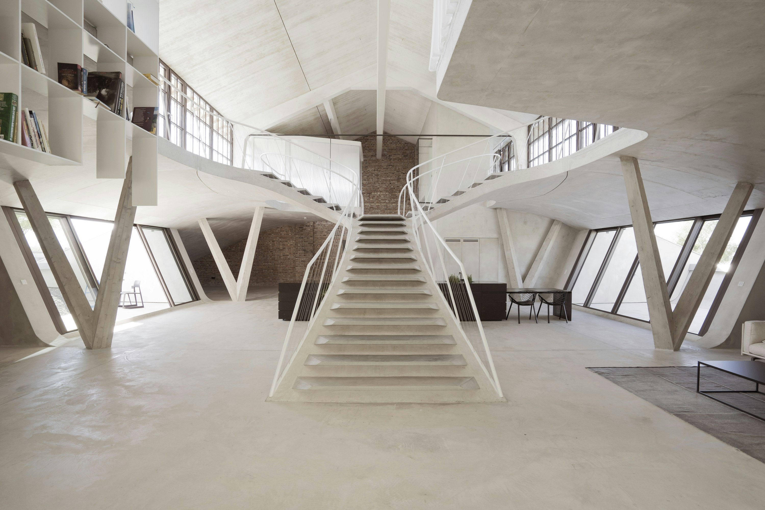 This Loft With a Stunning Staircase Looks Like a James Bond Villain's Lair  - Dwell