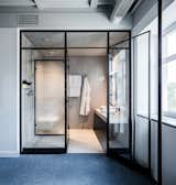 One of the bathrooms is conceived as a modern glass box.