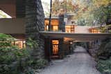 Fallingwater, view of entry (center) with trellis beams extending across drive.