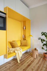 An ingenious small-space solution turns a wall into a sitting area.