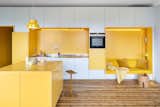A Renovated Apartment in Sweden Boasts Sunny Yellow Storage Walls