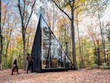 Measuring only 180 square feet, this sleek, prefabricated, off-grid tiny home rotates the classic A-frame cabin structure by 45 degrees to create more usable floor space. Sited in Hudson Valley, the sleek, black cabin by BIG and prefab housing startup Klein is the first model in a series of tiny homes that Klein plans to sell directly to consumers.