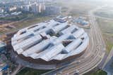 The first building that’s part of a new tech campus being developed, the Skolkovo Institute of Science and Technology University’s East Wing Building is designed in the form of a massive, partially filled ring with a 919-foot diameter, and jigsaw-like roofline.&nbsp;