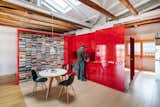 An Art Gallerist’s Bachelor Pad in Madrid Revolves Around a Bold Red Storage System