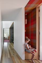 A seat and storage nook along the hallway.
