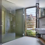 A bathroom with a corner shower.