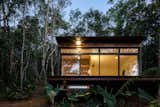 This pint-sized plywood-and-corrugated-metal cabin was carefully constructed to minimize site disturbance in a forested enclave of São Paulo, Brazil. Designed by Brazilian architect Silvia Acar, the retreat has a glass facade, which allows cabin dwellers to feel at one with nature.