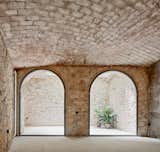 The vaulted doors lead out to a courtyard.