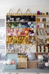 Shelves of yarn in Erin's workspace.