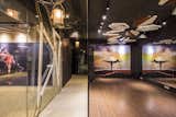 Line of Control-A glass partition separating the passage from the studio—a study in modern retail design.