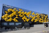 The striking yellow panels stand out in the dull background
