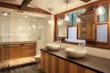 The Master Bathroom combines mirrors and an opaque film with the existing windows for light and privacy