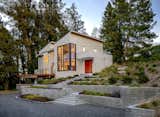 View upon approach, the "setpiece" of the home is a two story volume to both welcome visitors and highlight the dramatic view from inside. 