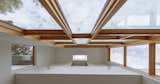 Looking up into two story space,  skylight evacuates heat from lower level