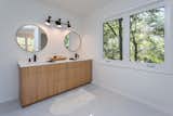 Custom white oak double vanity in Owner Suite