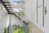 Staircase, Glass Railing, Wood Tread, and Metal Tread  Photo 4 of 21 in Mississippi River Valley Residence by Sustainable 9 Design + Build