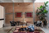 Bedroom  Eastern European flatweave -- Bolivian textiles - updated one of a kind equipale chairs - fig plants 