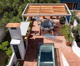 Terrace w/ glass table skylights to Living below - homemade adjustable shade structure - custom chaises