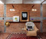 Bedroom - blackened  steel channel for flexible art display - in house designed locally made cane chair 