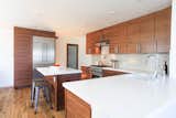 Custom Grain Matched Walnut Kitchen Cabinetry by Able + Baker.  Cabinetry includes furniture style legs.  Photo 4 of 7 in Kitchens by Able and Baker by Able and Baker Cabinetry