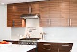 Grain Matched Walnut custom cabinetry, handcrafted in our woodshop.  Photo 1 of 7 in Kitchens by Able and Baker by Able and Baker Cabinetry