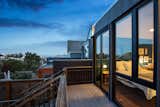 Exterior, House Building Type, Wood Siding Material, and Flat RoofLine rear facade at night - sho sugi ban siding  Photo 18 of 18 in Noe Valley home by patrick perez/designpad architecture