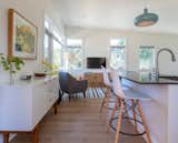 Kitchen, Engineered Quartz Counter, Pendant Lighting, White Cabinet, and Light Hardwood Floor View of interior, kitchen and living space  Photo 3 of 9 in Mill Valley ADU by patrick perez/designpad architecture