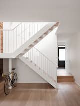 Light metal staircase combine with skylight  bring light to the heart of the house 