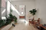 Second floor den filled with planters and flood with natural light 