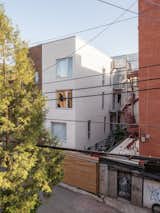 Exterior, Brick Siding Material, Apartment Building Type, and Flat RoofLine Back facade  Photo 17 of 20 in RJM apartment by Alexandre Bernier Architecte