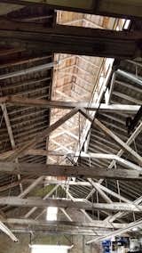 The sixty foot tall ceilings helped to keep the warm air high and the cool air low in the ice house. The large dormer, stretching end to end, holds rows of windows, letting in able light.
