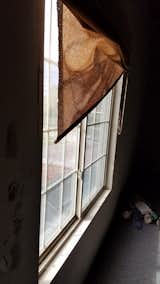 The large replacement windows  keep the elements out and add character to this industrial space.