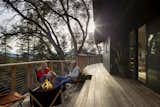 The deck was extended to circle the cliff-side edge of the house, creating a variety of outdoor spaces. 