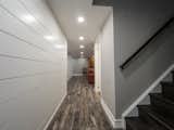 A contemporary Penguin finished basement renovation in Brampton, Ontario that makes the most of a narrow space.