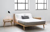 Kastella B107 is a solid wood structure seen here with upholstered headboard. 