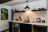 Wet bar with drawer dishwasher, beverage/ wine cooler and ample storage