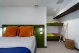 Family extra bedroom with built-in bunks and large closet