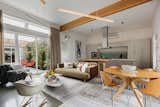 Living Room, Chair, Coffee Tables, Sofa, Concrete Floor, Ceiling Lighting, and Pendant Lighting Open Living/Dining/Kitchen  Photo 13 of 26 in Nico's House by Mark A Cuellar, Design+Build